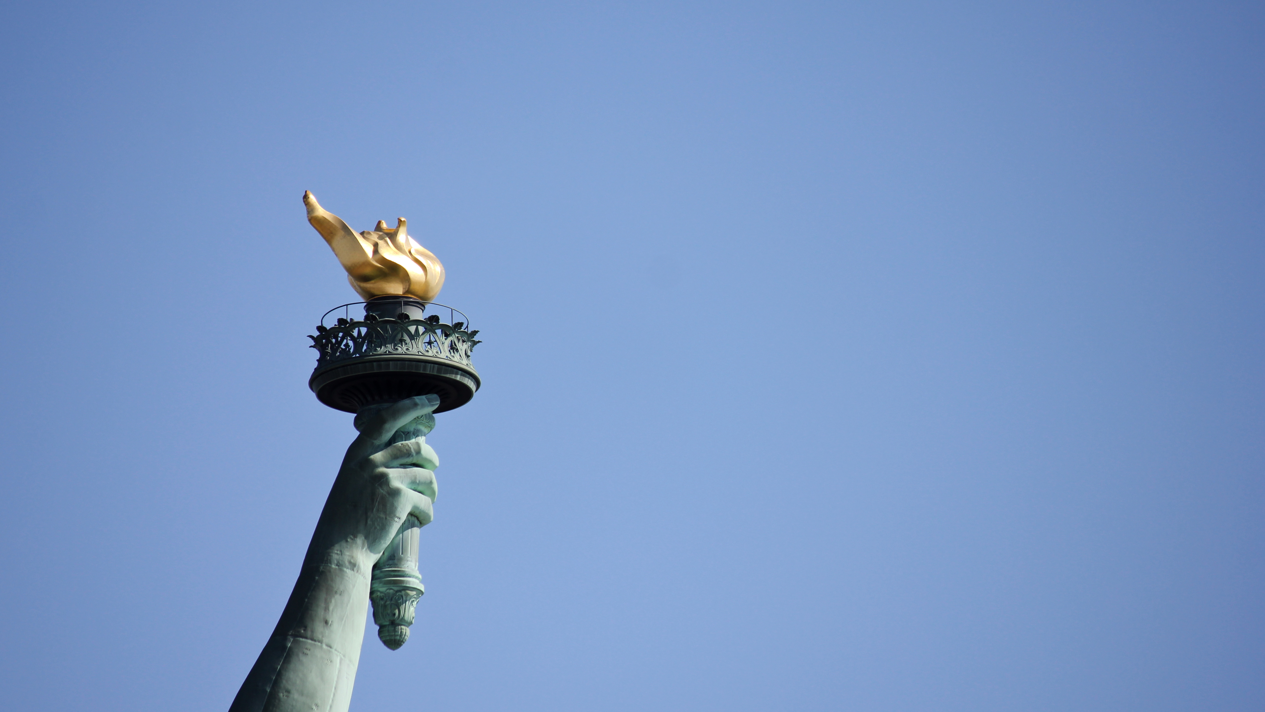 Statute of liberty torch and flame freedom house