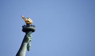 Statute of liberty torch and flame freedom house